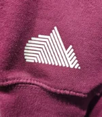burgundy sleeve logo closeup